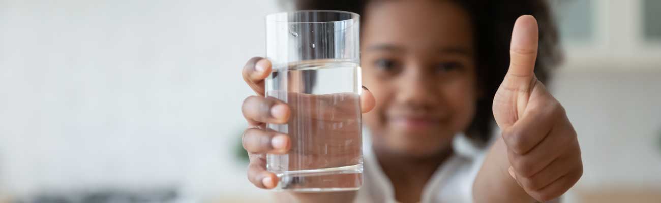 Happy child with soft, clean water Happy child with soft, clean water